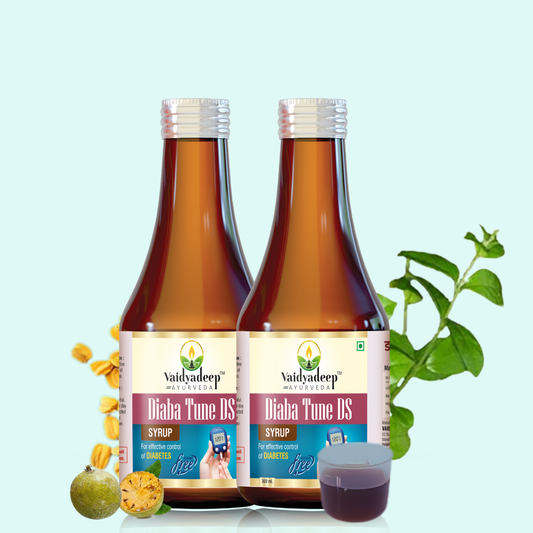 Two bottles of Vaidyadeep Diaba Tune DS Syrup with a plant on a light blue background