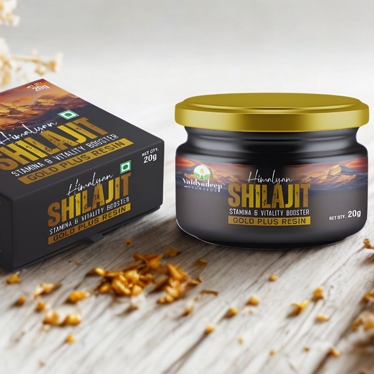 Himalayan Shilajit jar and packaging on a wooden surface with resin scattered around.