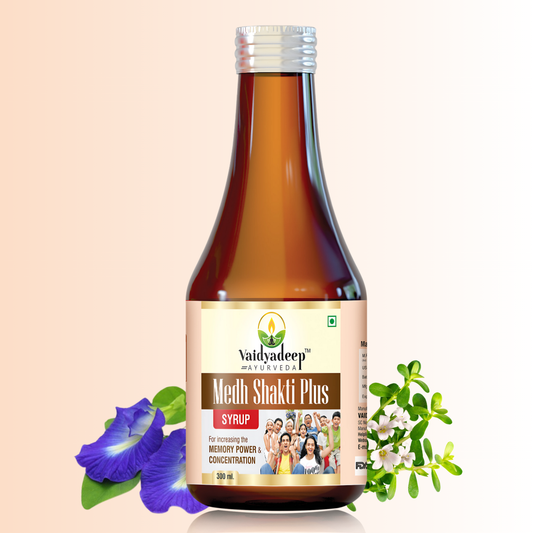 Bottle of Vaidyadeep Medh Shakti Plus Syrup with leaves and flowers on a beige background