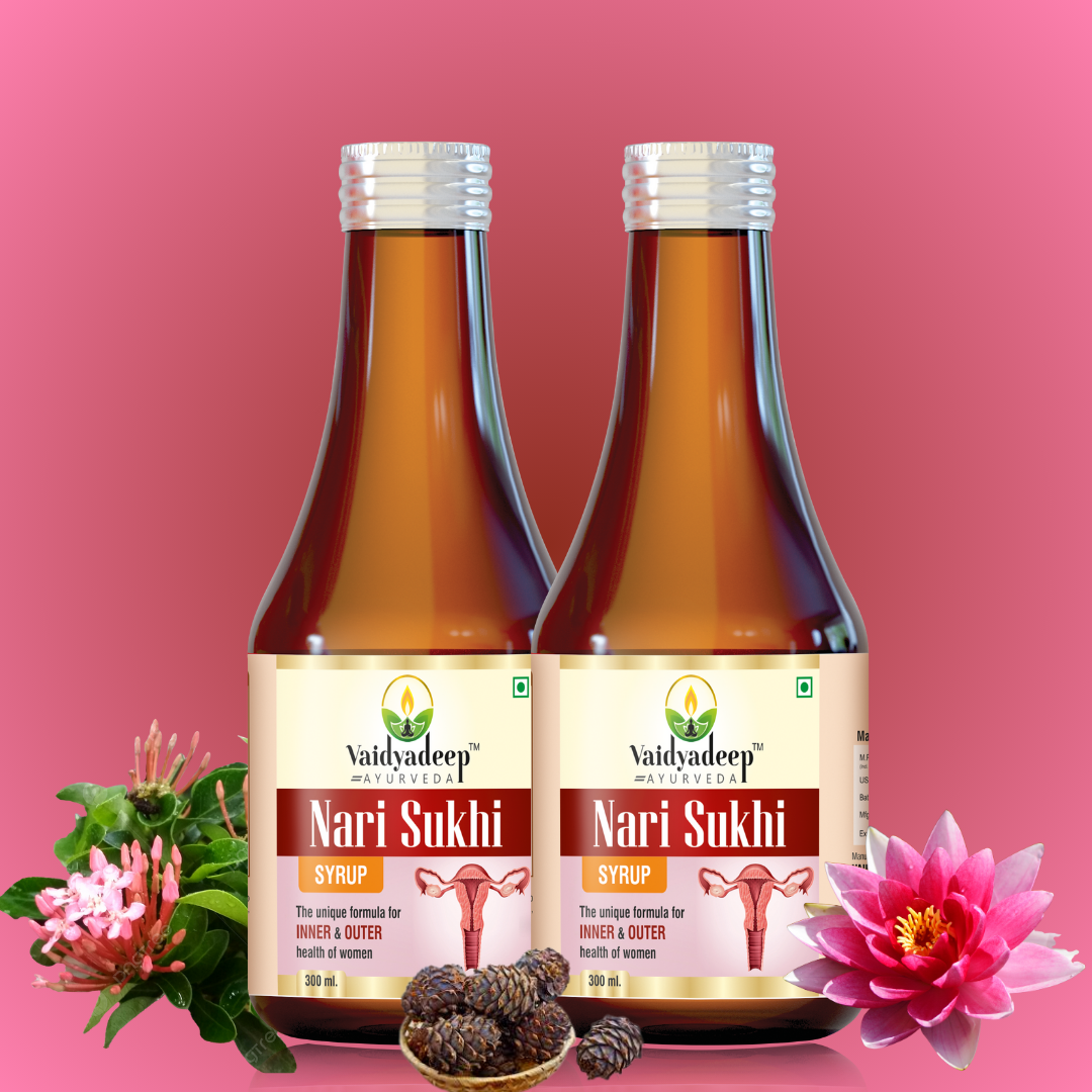 Two bottles of Nari Sukhi syrup with flowers and herbs on a pink background